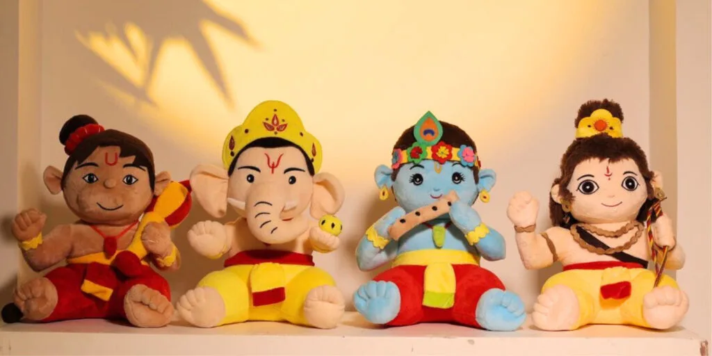Young child listening to a mantra chanting plush toy